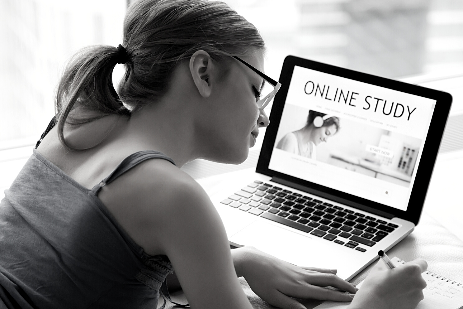 Woman searching online courses for self-education